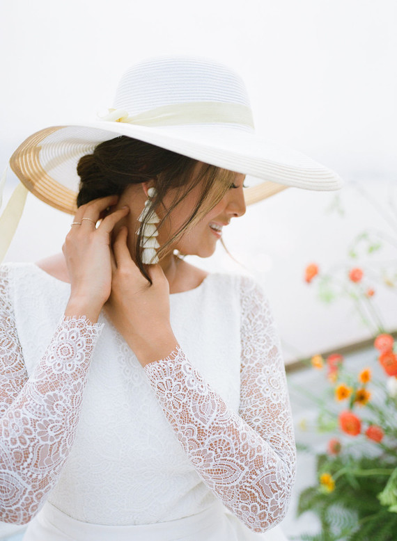 End of summer retro engagement shoot in a rowboat full of flowers