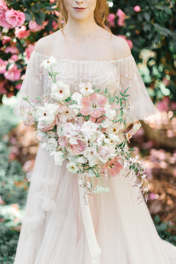 A stunning bridal editorial with a giant pink camellia tree