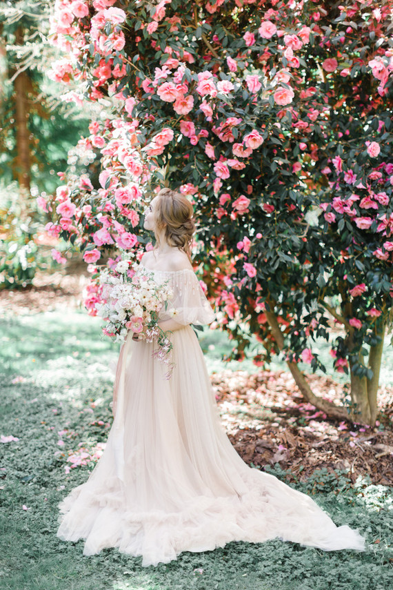 A stunning bridal editorial with a giant pink camellia tree