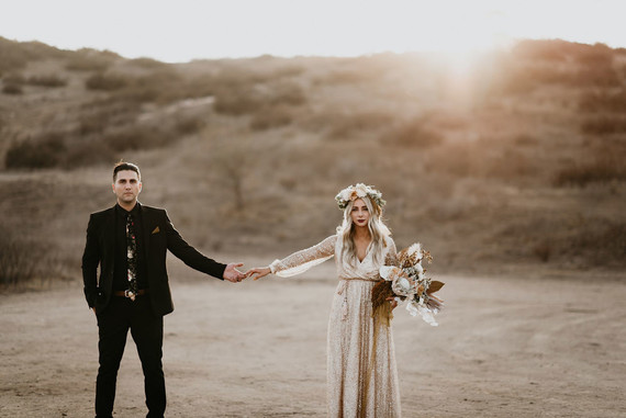 Boho vow renewal with a palm frond teepee at Wolf Feather Honey Farm