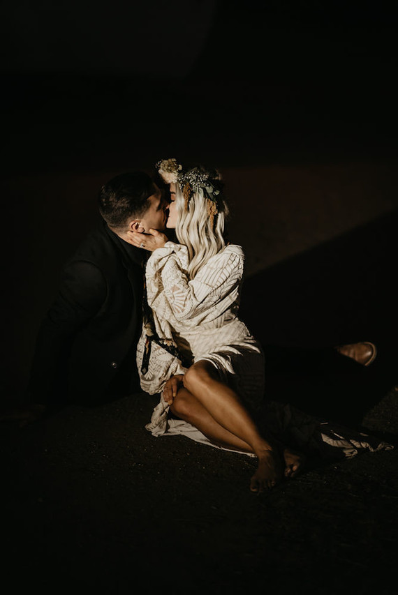 Boho vow renewal with a palm frond teepee at Wolf Feather Honey Farm