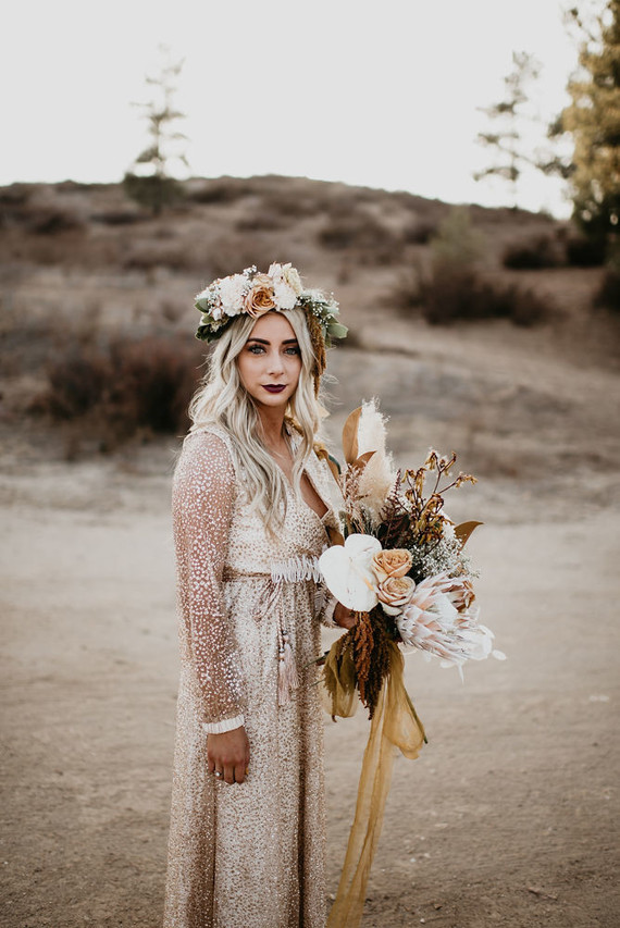 Boho vow renewal with a palm frond teepee at Wolf Feather Honey Farm
