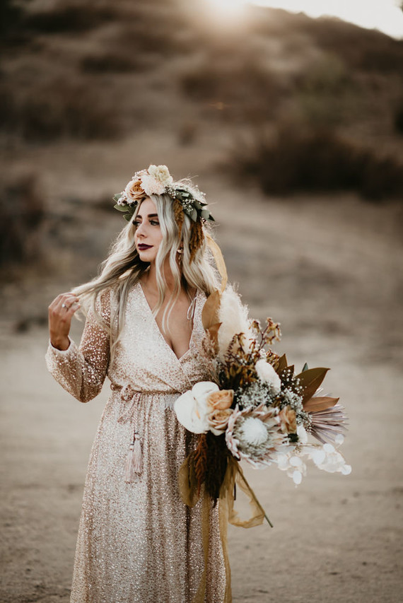Boho vow renewal with a palm frond teepee at Wolf Feather Honey Farm
