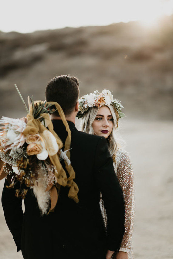 Boho vow renewal with a palm frond teepee at Wolf Feather Honey Farm Inspiration