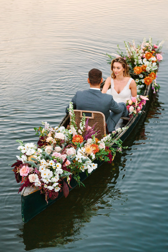 wedding portrait in a floral canoe