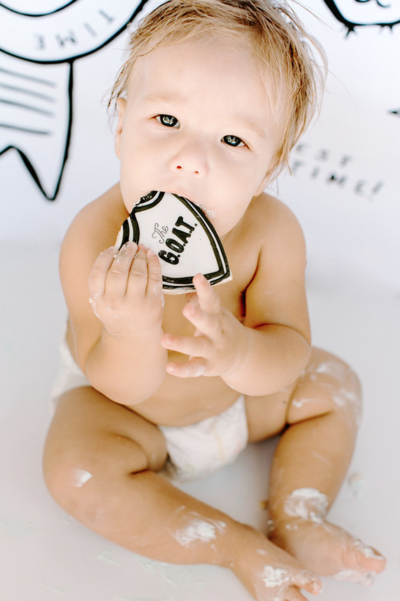 Greatest of All Time (G.O.A.T.) first birthday cake smash session Inspiration