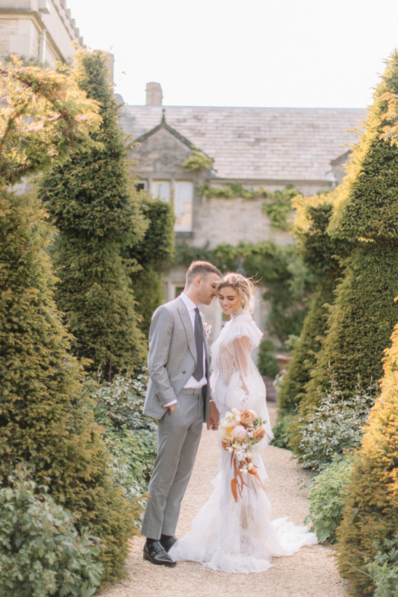 Modern stylish fairytale wedding in a dramatic English garden