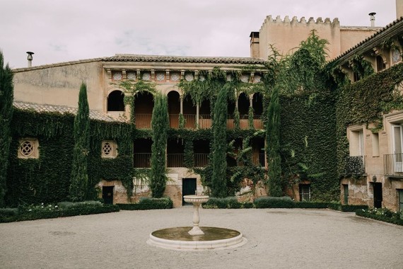 A moody dream garden wedding for a fashion forward couple at Palacio Villahermosa in Spain