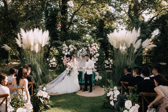 A moody dream garden wedding for a fashion forward couple at Palacio Villahermosa in Spain