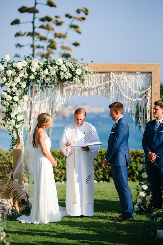 Modern beachy macrame ceremony backdrop