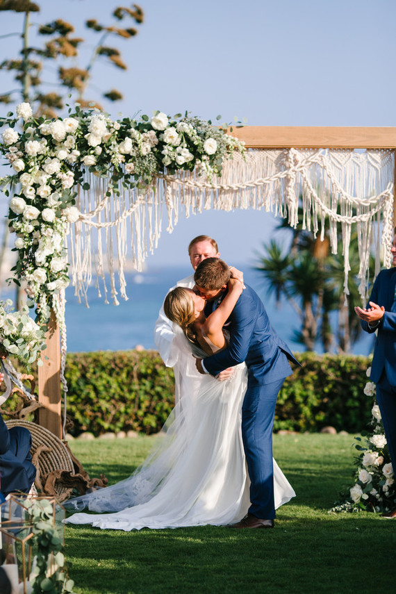 Modern beachy macrame ceremony backdrop