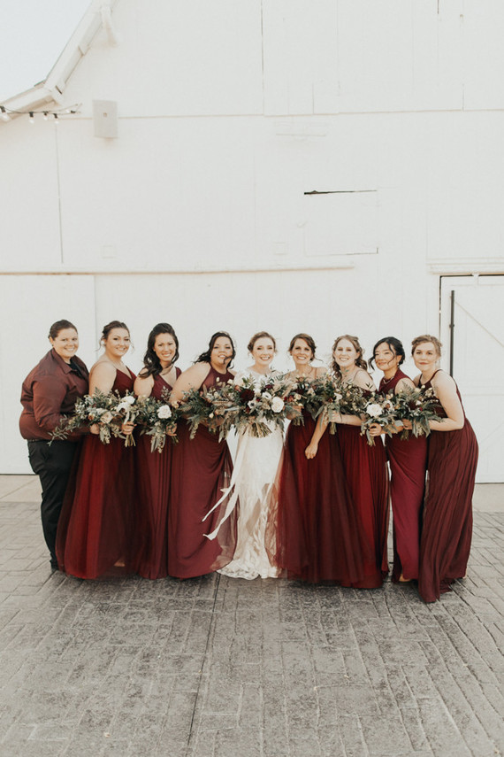 burgundy bridesmaid dresses at dreamy white barn venue in Kansas City
