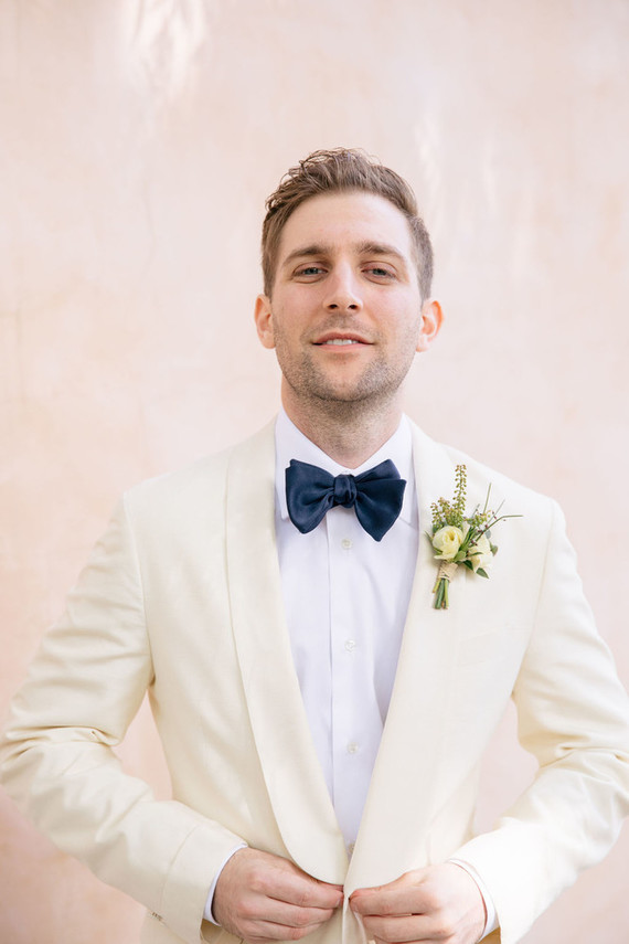 Groom with a white dinner jacket