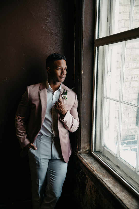 Fashion-forward groom style with a mauve jacket