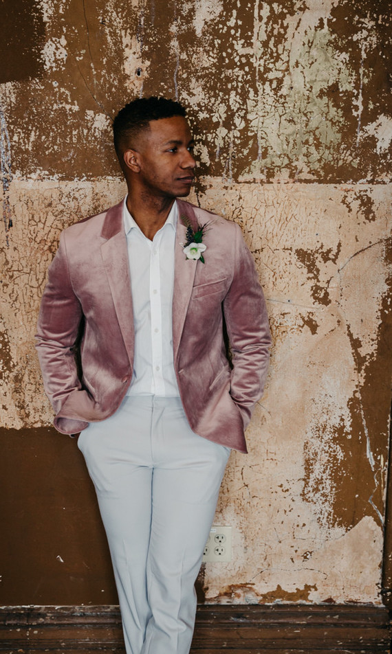 Fashion-forward groom style with a mauve jacket