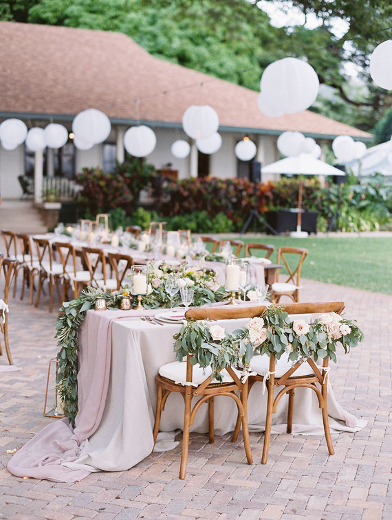 Romantic mauve Maui wedding with the most magical reception setting at Olowalu Plantation House