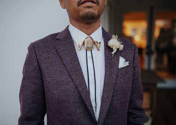 purple groom's suit