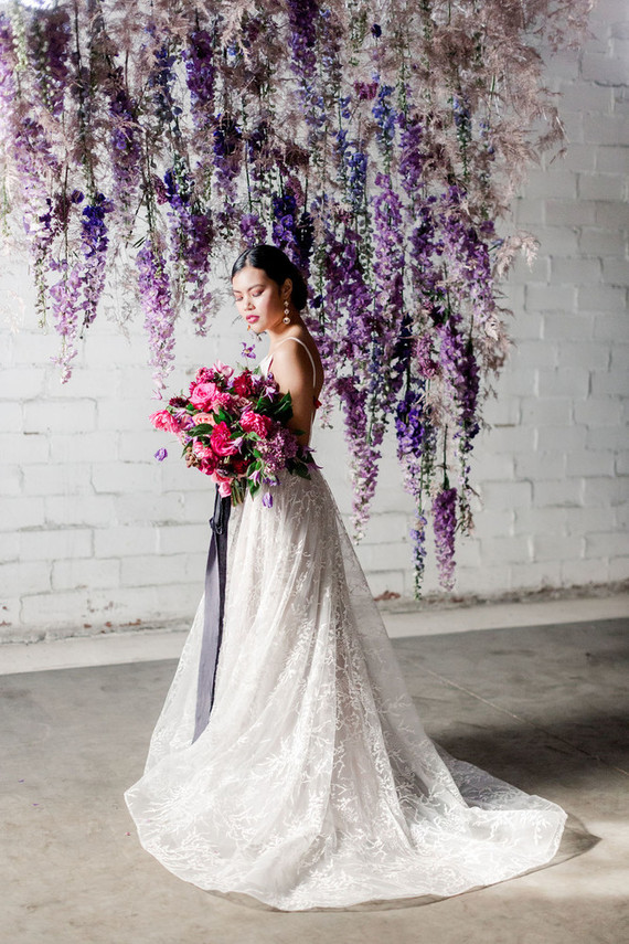 Bright moody spring wedding inspo with a dramatic floral curtain