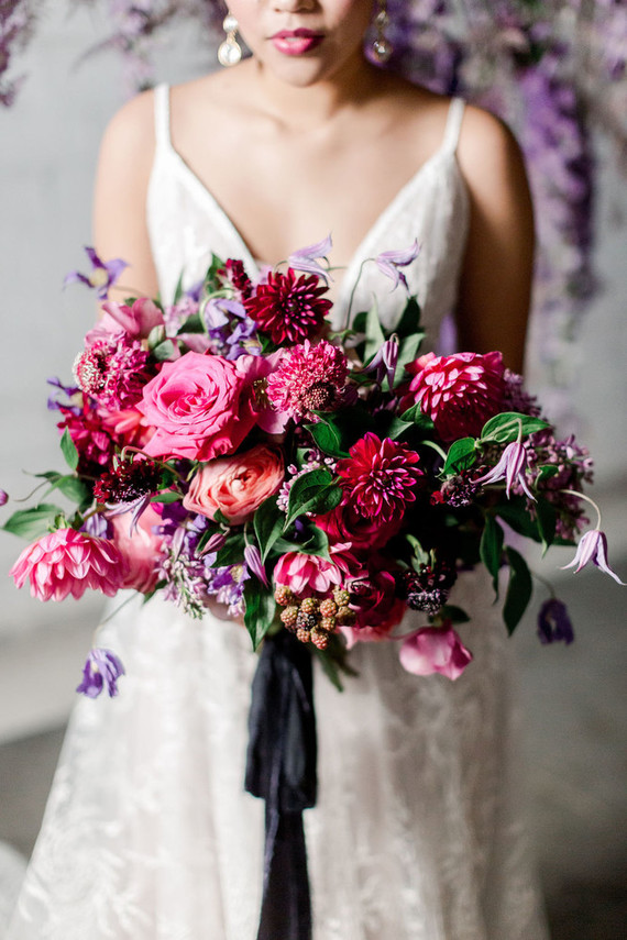 Bright moody spring wedding inspo with a dramatic floral curtain