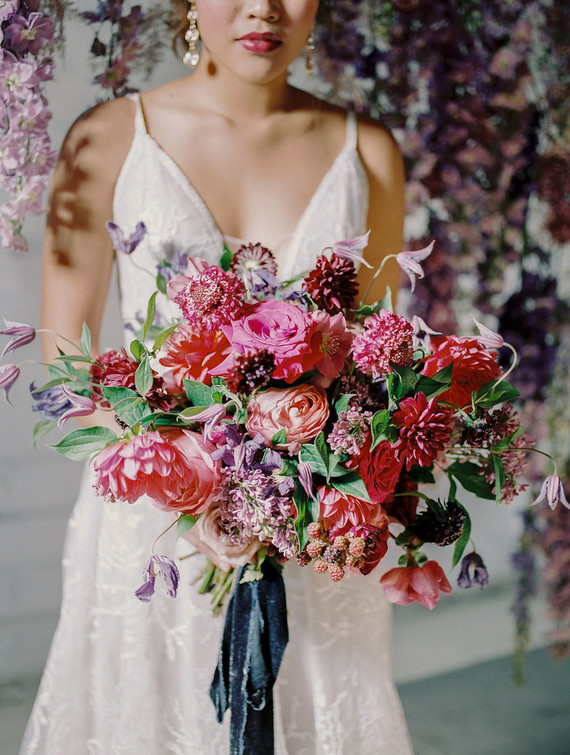Bright moody spring wedding inspo with a dramatic floral curtain