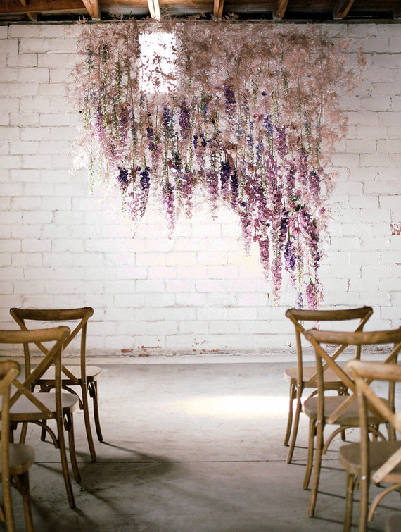 Bright moody spring wedding inspo with a dramatic floral curtain