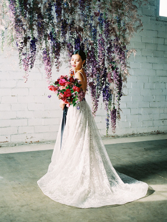 Bright moody spring wedding inspo with a dramatic floral curtain