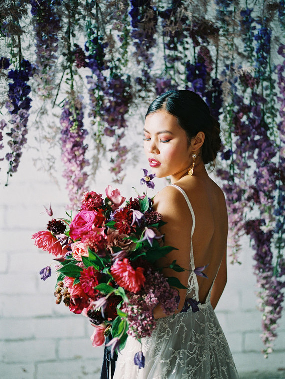 Bright moody spring wedding inspo with a dramatic floral curtain