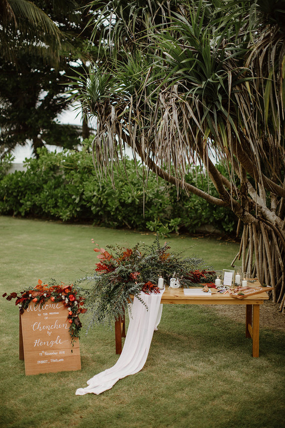 Tropical fall wedding in Thailand with rust and peachy accents