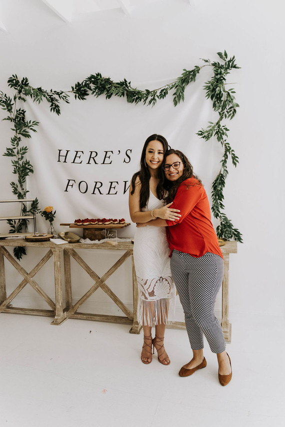 All white olive branch bridal shower with an epic grazing table