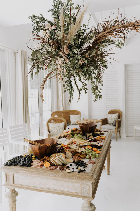 All white olive branch bridal shower with an epic grazing table