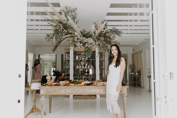 All white olive branch bridal shower with an epic grazing table