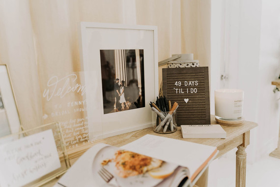 All white olive branch bridal shower with an epic grazing table