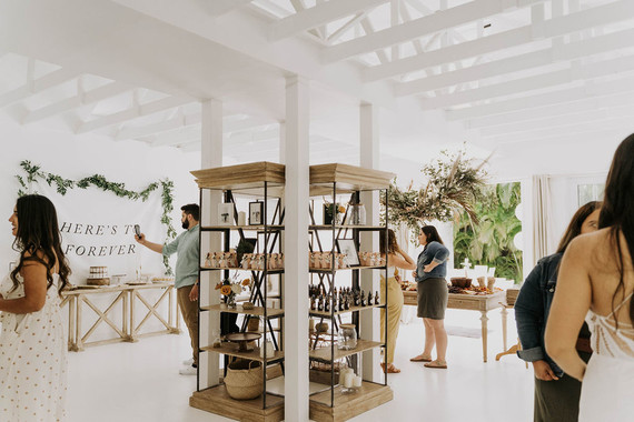 All white olive branch bridal shower with an epic grazing table