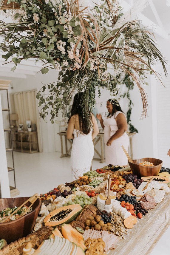 All white olive branch bridal shower with an epic grazing table