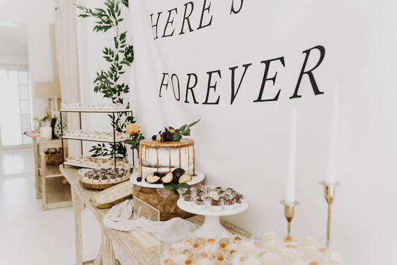 All white olive branch bridal shower with an epic grazing table