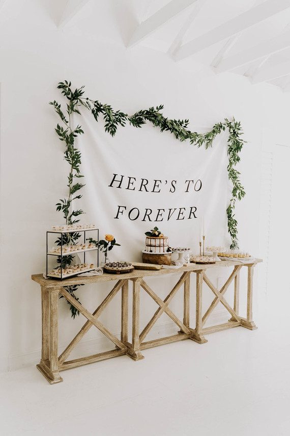 All white olive branch bridal shower with an epic grazing table