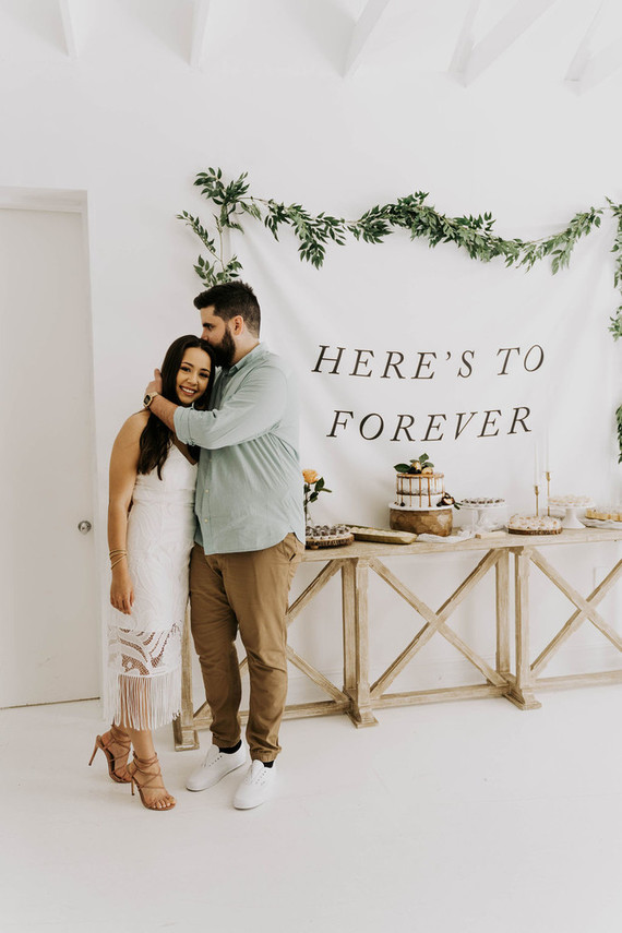 All white olive branch bridal shower with an epic grazing table