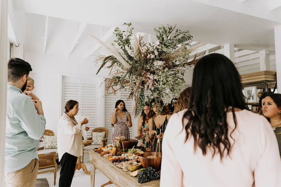 All white olive branch bridal shower with an epic grazing table