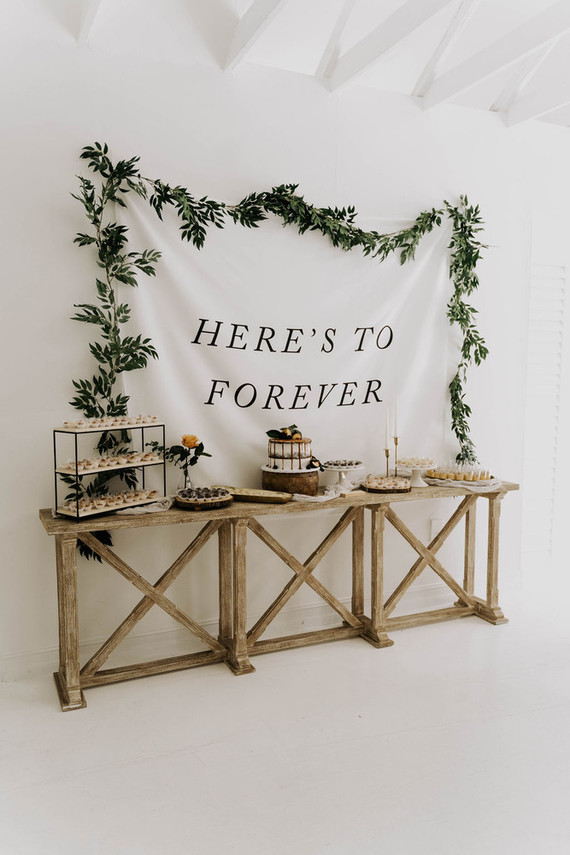 All white olive branch bridal shower with an epic grazing table