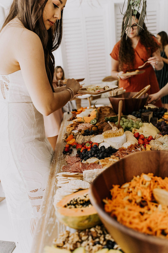 All white olive branch bridal shower with an epic grazing table