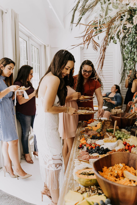 All white olive branch bridal shower with an epic grazing table