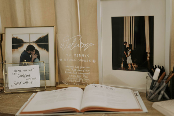 All white olive branch bridal shower with an epic grazing table