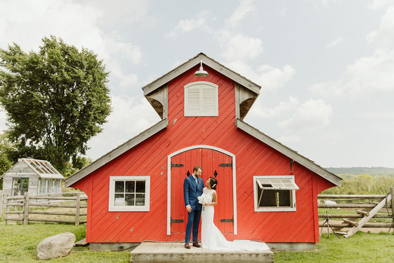 Farm to table summer wedding with pops of red and a PARADE