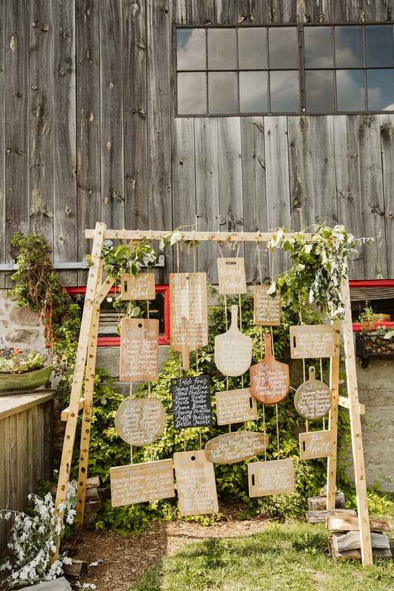 Cutting board seating chart for a farm to table barn wedding