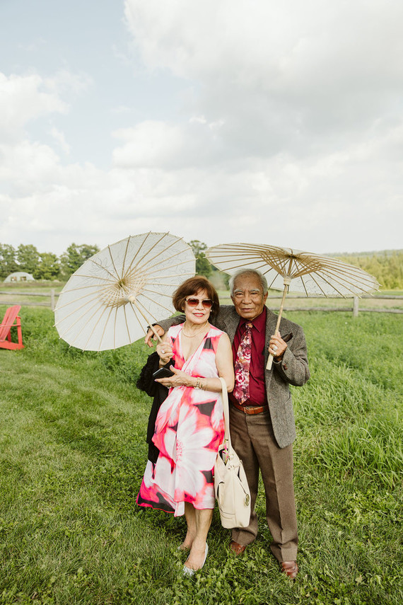 Farm to table summer barn wedding with pops of red and a PARADE