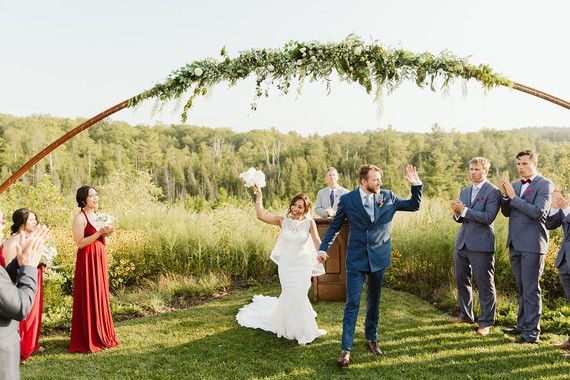 Farm to table summer barn wedding with pops of red and a PARADE