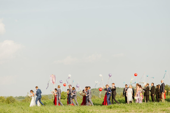 Farm to table summer barn wedding with pops of red and a PARADE