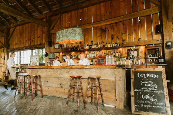 Farm to table summer barn wedding with pops of red and a PARADE