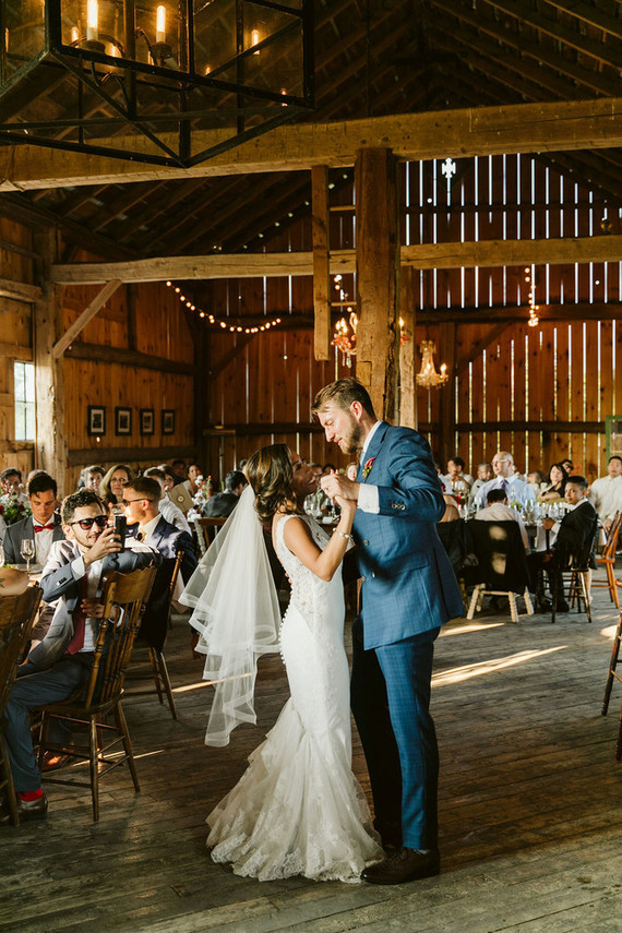 Farm to table summer barn wedding with pops of red and a PARADE