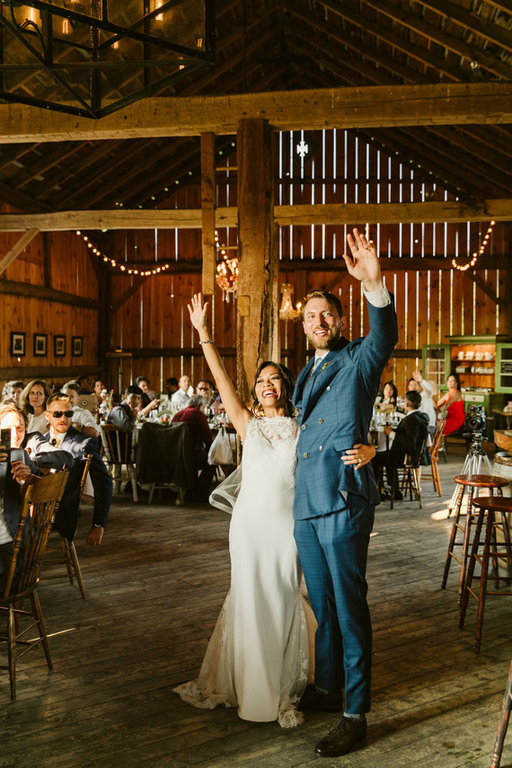 Farm to table summer barn wedding with pops of red and a PARADE